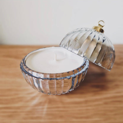 A Silver bauble showing the candle inside