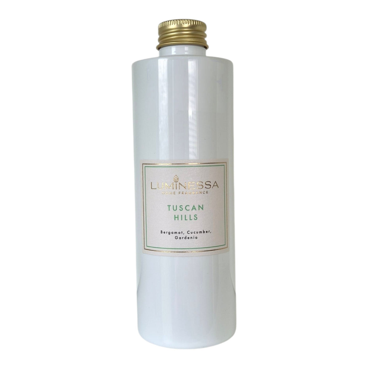 A tall, cylindrical white bottle with a gold screw cap and a cream-colored label reading 'LUMINESSA TUSCAN HILLS' on a plain white background.